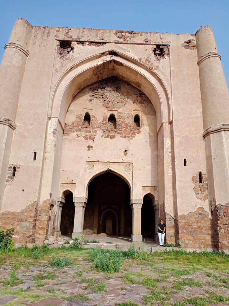 The three arched openings with tapering minarets on its flanks-the Tughlaqi Style Mihrab