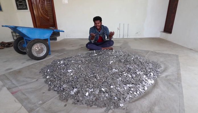 bhoopathi with a heap of rupee coins