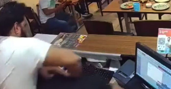 3 men thrasing restaurant employee