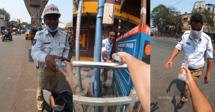 biker distributes water bottles